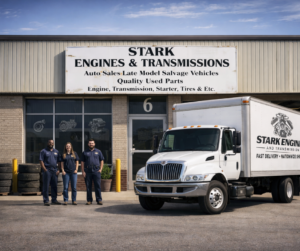 Stark Engines and Transmissions warehouse with branded delivery truck and team, offering fast nationwide shipping of used engines and transmissions across the USA